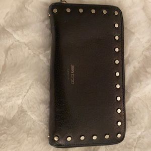 Jimmy Choo wallet.  Looks nice in and out of the bag! No stains.